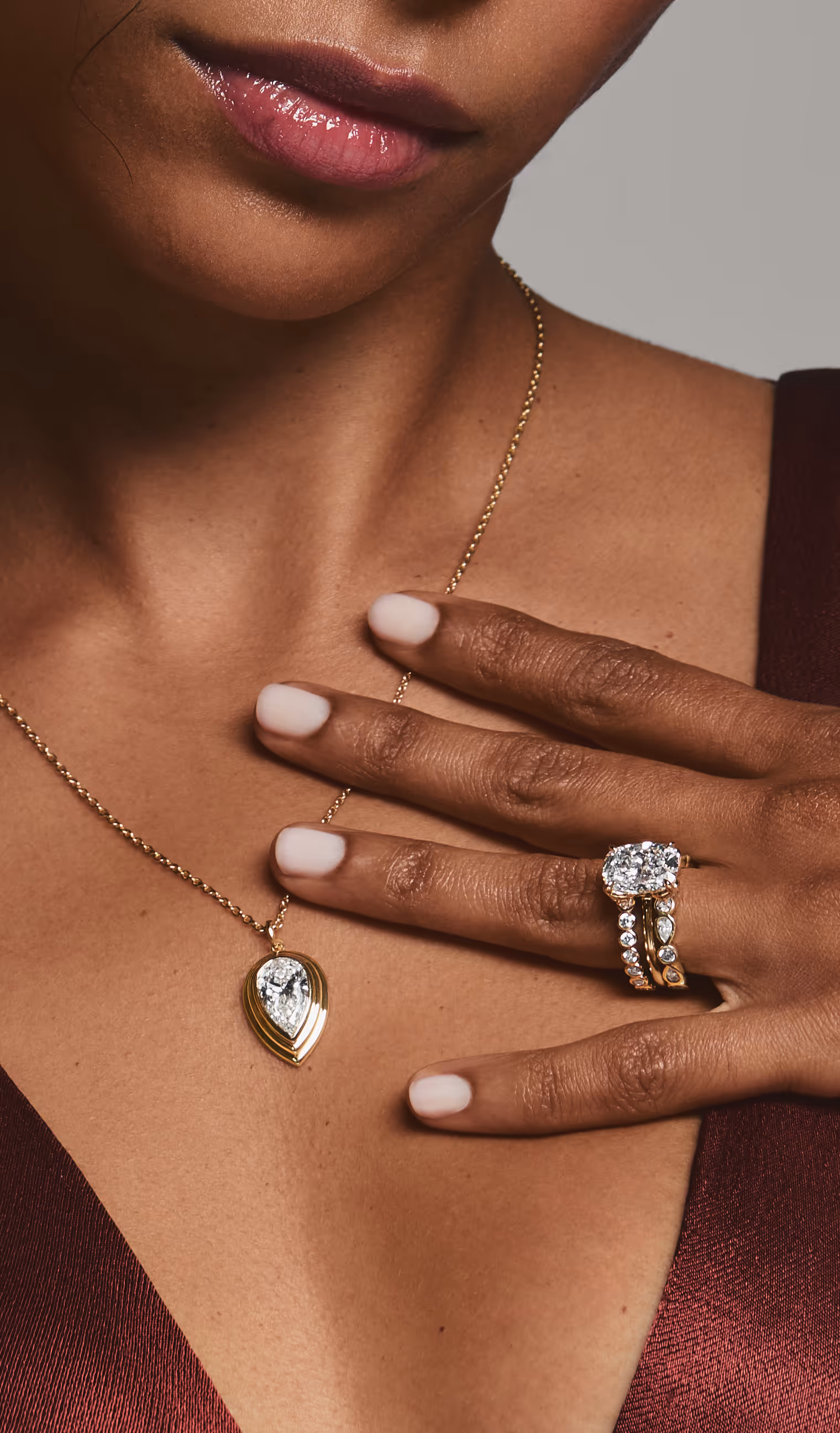 A close-up of an engagement ring with text overlay reading 'Find the Perfect Ring, Make it yours' against a dark background